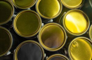 closed-new-paint-cans-with-golden-lids-closeup_187194-816
