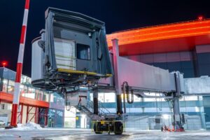 empty-passenger-jet-bridge-night-airport-apron_527900-1253