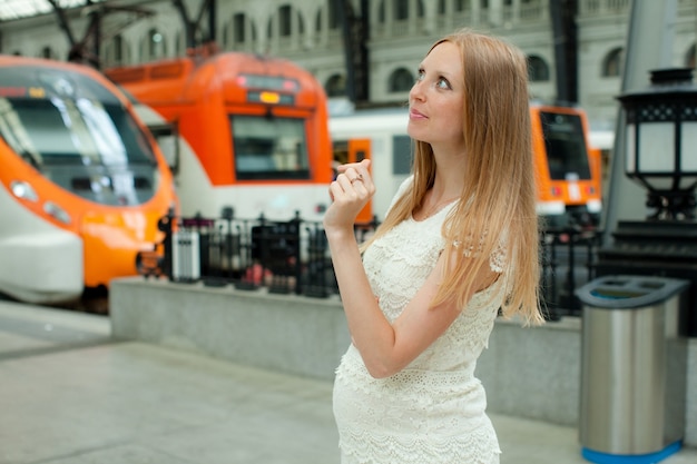 long-haired-woman-railway-station_1398-2602