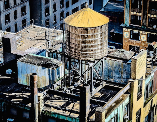 amazing-view-downtown-building-roof-with-water-tank-it_181624-27734