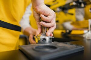 barista-packing-coffee-machine_23-2148523054