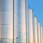 close-up-metallic-wine-barrels-winery_1268-15700