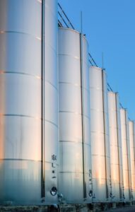 close-up-metallic-wine-barrels-winery_1268-15700