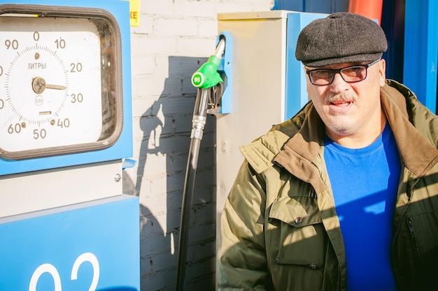 man-standing-by-machinery-gas-station_97722-449